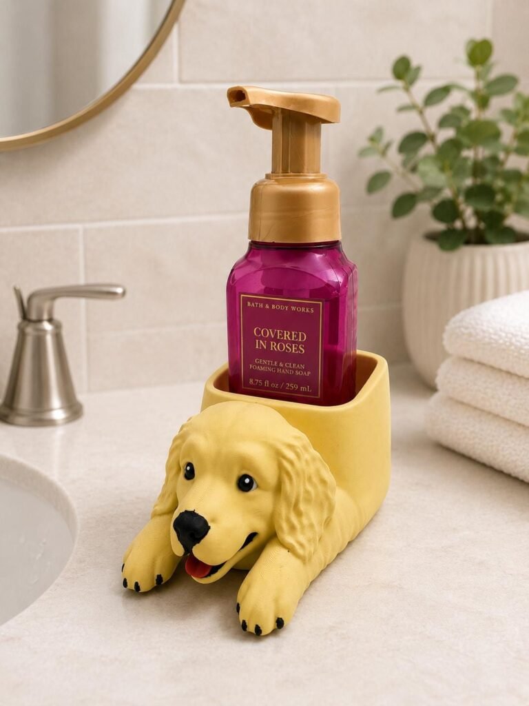 Golden Retriever soap bottle holder with a foaming soap bottle displayed beside a bathroom sink.